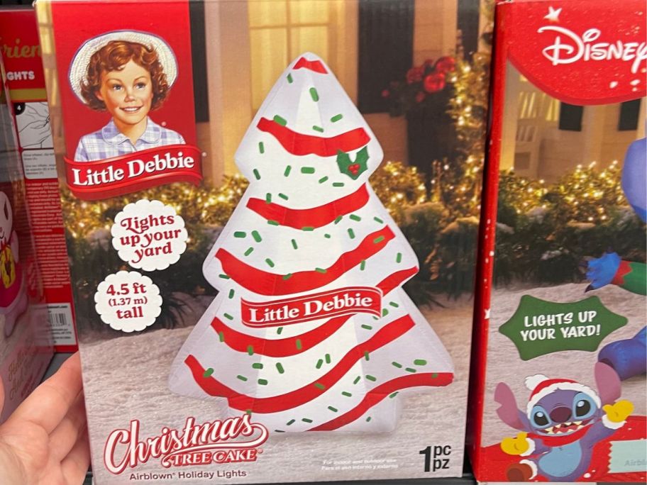 hand holding little debbie christmas tree