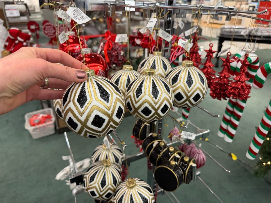 hand reaching for a Christmas ornament