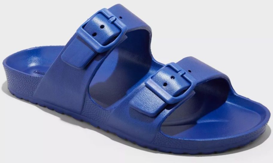 Close-up of a bold blue men&rsquo;s slide sandal featuring two adjustable buckle straps and a textured footbed, shown against a white background.