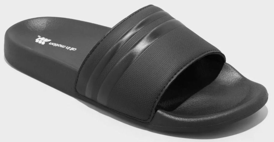 Men&rsquo;s black slide sandal by All in Motion featuring a wide textured strap and cushioned sole