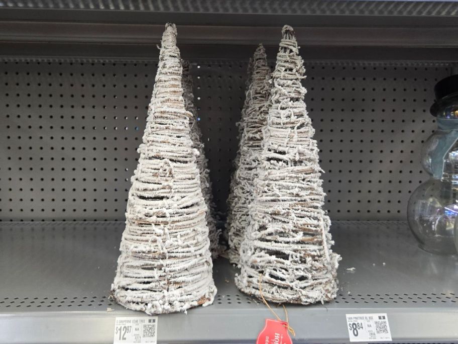 white Grapevine Cone Trees on shelf in store