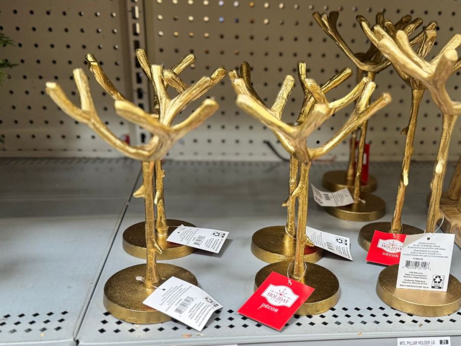 Holiday Time Medium Rustic Gold Antler Pillar Candleholders on shelf in store
