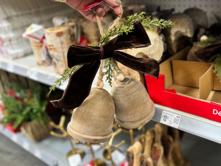 Wooden Bells in hand in store