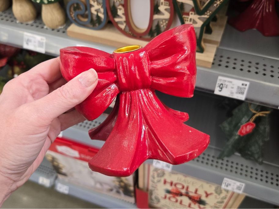 Red Bow Candleholder in hand in store