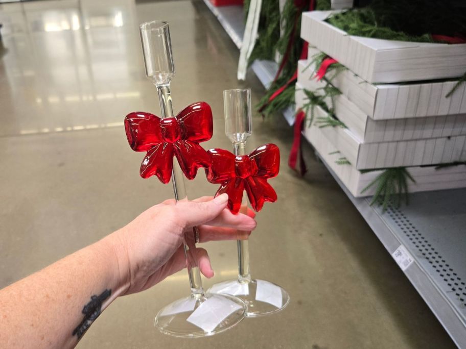 Glass Candleholders in hand in store