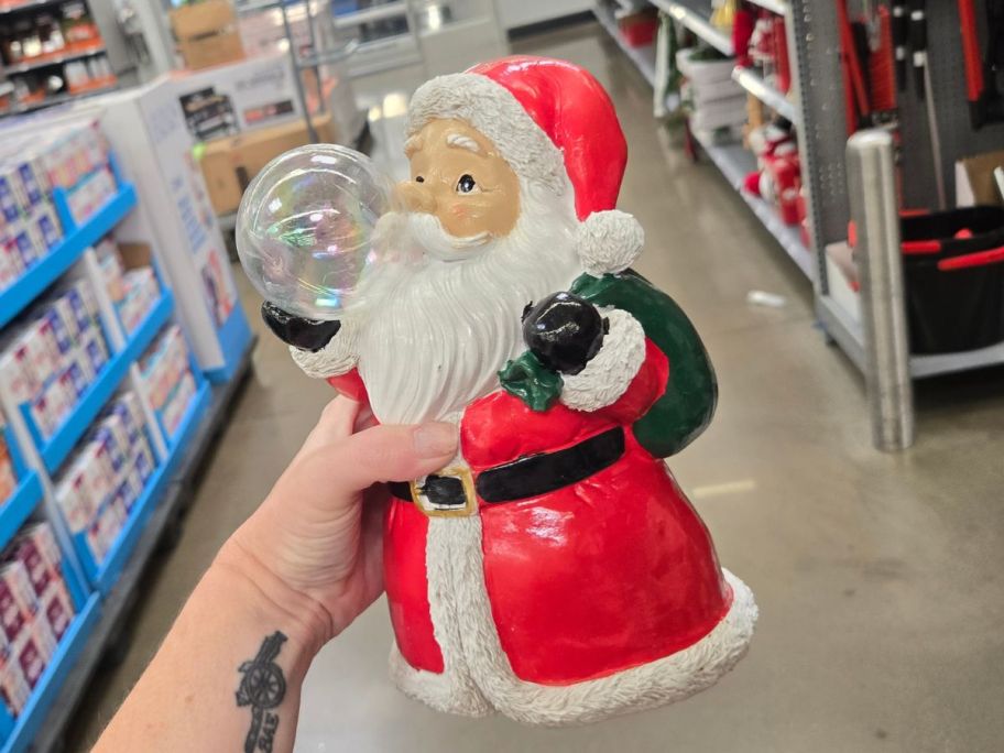 santa claus with bubble in hand in store