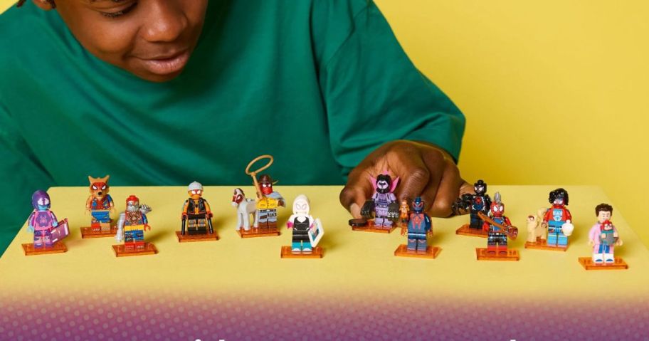 kid playing with LEGO Minifigures Spider-Man: Across the Spider-Verse Mystery toys
