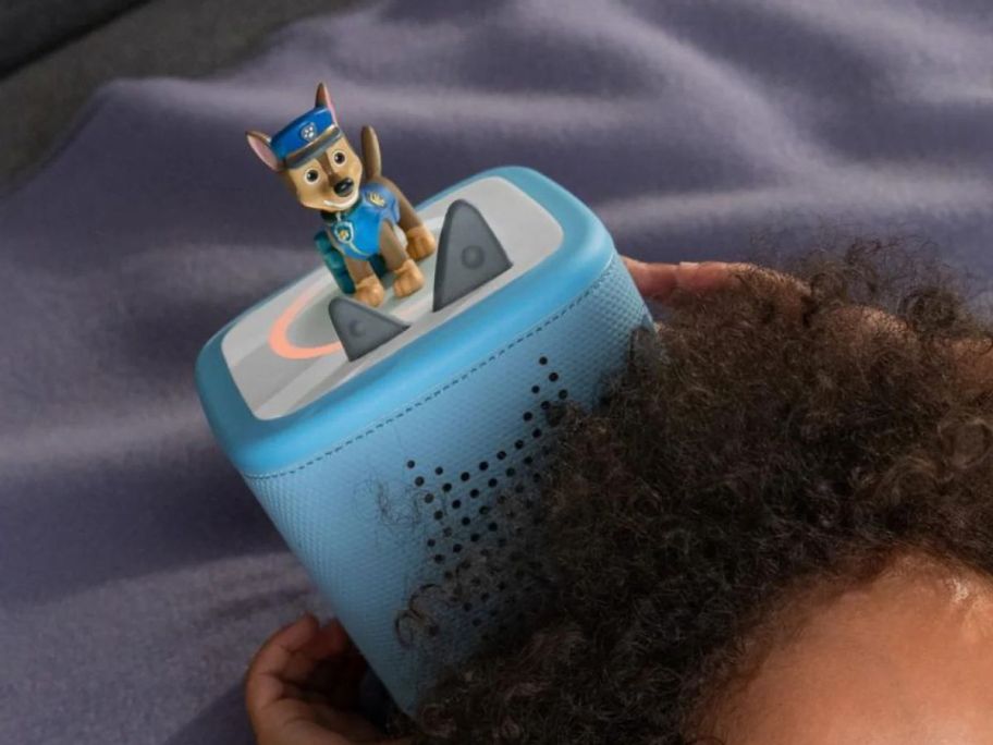 kid playing with tonies Toniebox 2 Audio Player Bundle w/ PAW Patrol Chase Tonie above his head