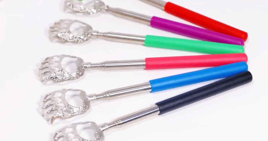 set of telescoping back scratchers with handles in various colors