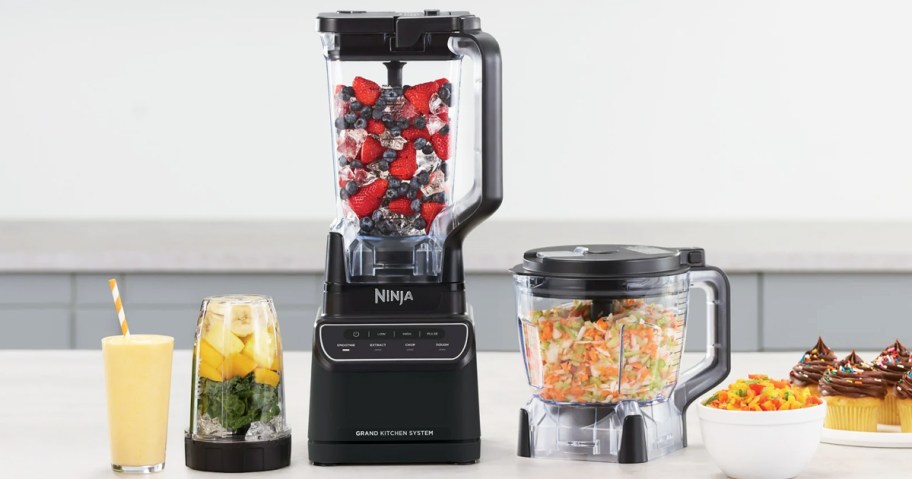 ninja blender, food processor, and blender cup on kitchen counter