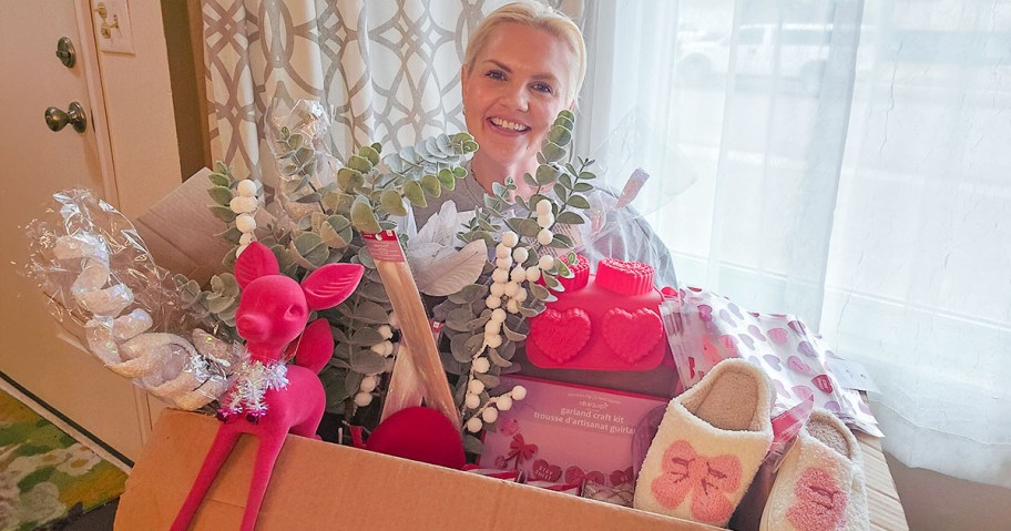 Woman holding box of goods from Michaels in a $10 grab box