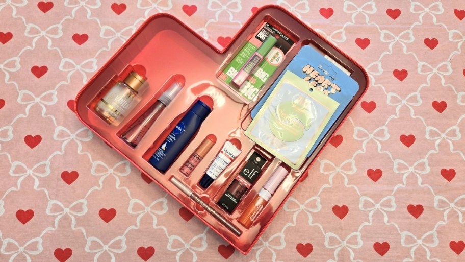 mini and fullsized beauty items in a heart shaped box