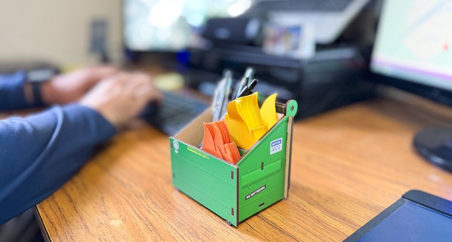 dumpster post it holder on office desk