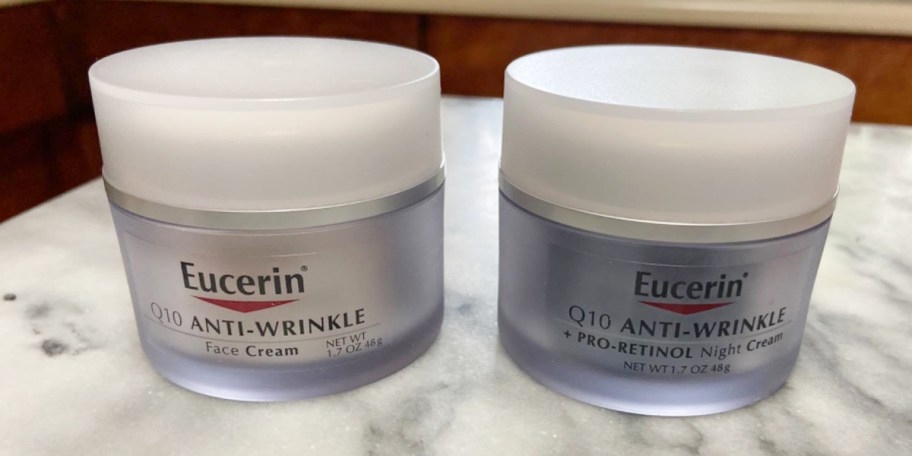 eucerin night and day cream jars on countertop