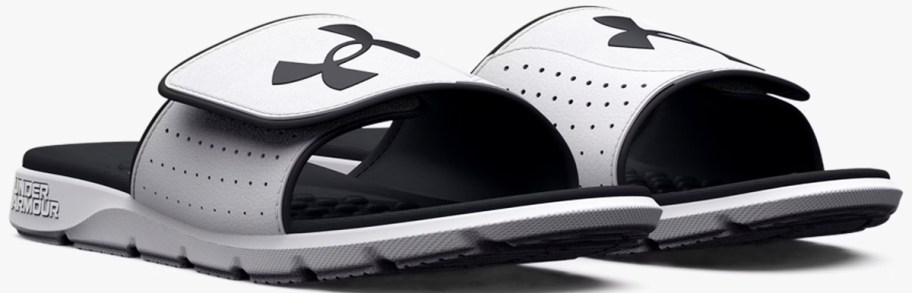pair of light grey and black under armour slides