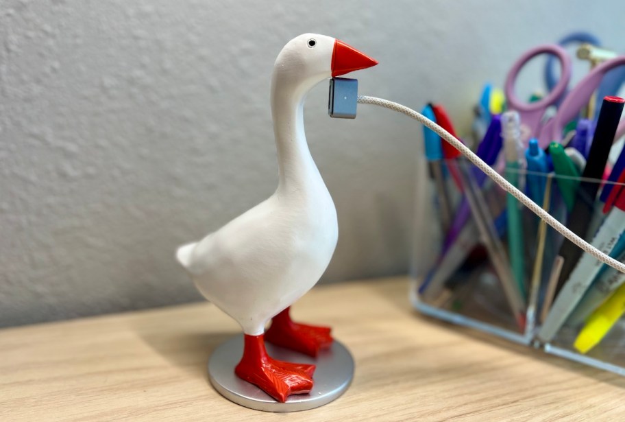 goose on desk with metal magnetic cord sticking to neck