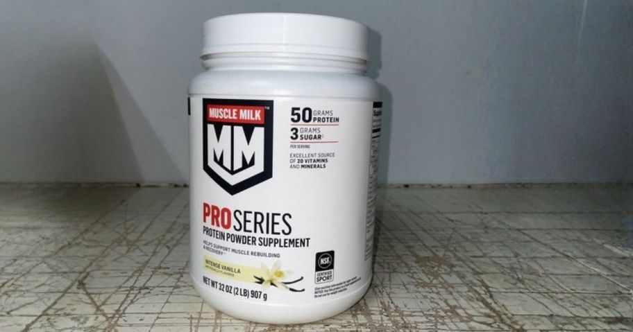Muscle Milk Pro Series Protein Powder tub on table