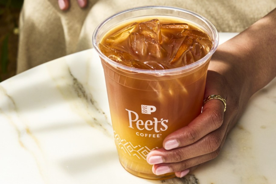 hand holding iced coffee