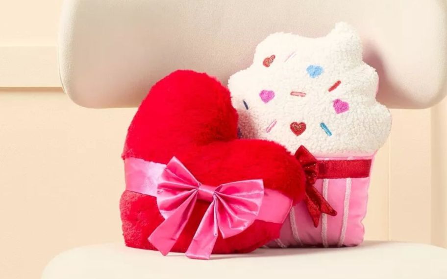 valentines day throw pillows on top of a chair