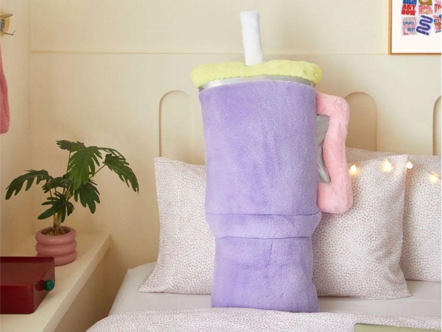 Your Zone Tumbler Travel Cup Shaped Plush Body Pillow on bed