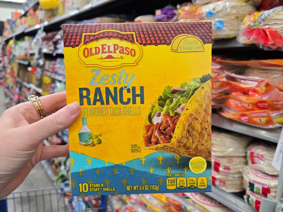 hand holding a box of Old El Paso Stand &lsquo;N Stuff Crunchy Taco Shells, Zesty Ranch 