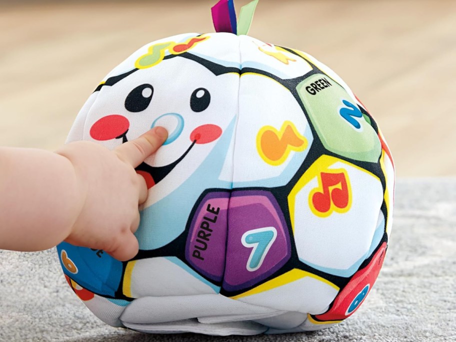 Kiddo playing with sound making ball-2