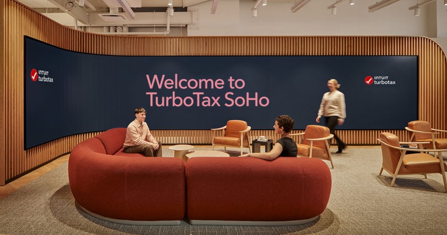 people on a sofa and walking around a TurboTax Store
