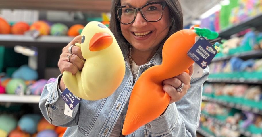 Woman holding a squishy duck and carrot from Walmart