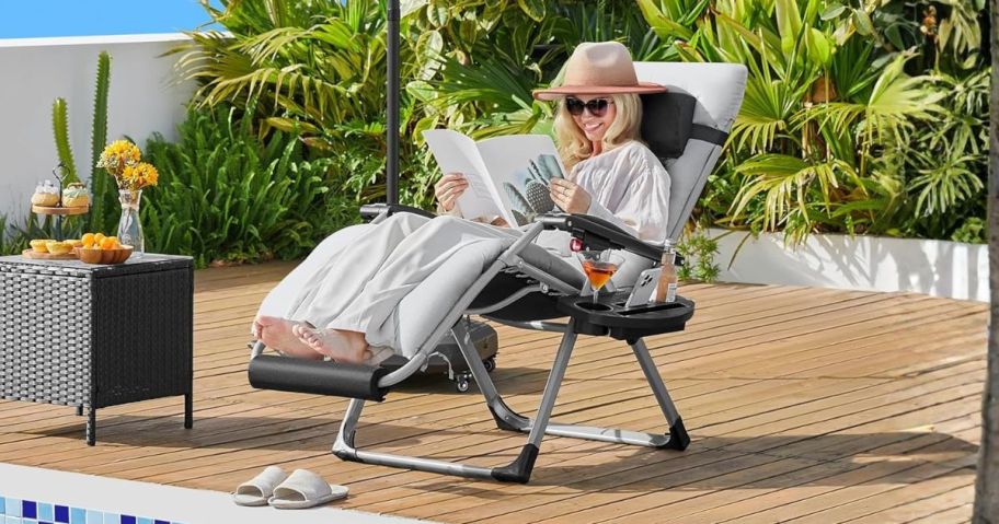 woman sitting on Yaheetech Zero Gravity Chair poolside