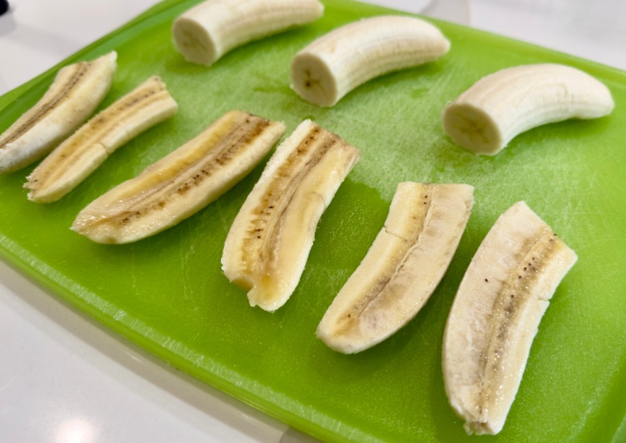 bananas sliced on green cutting board