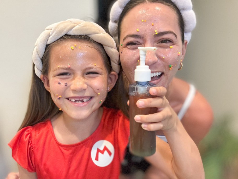 mother and daughter with nerds face wash on faces