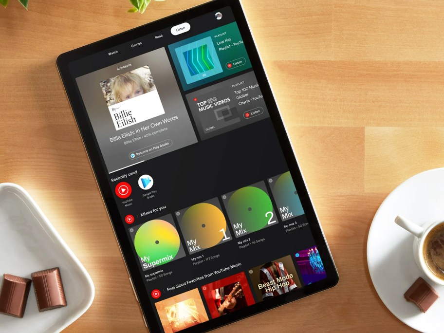 black tablet on a wood table