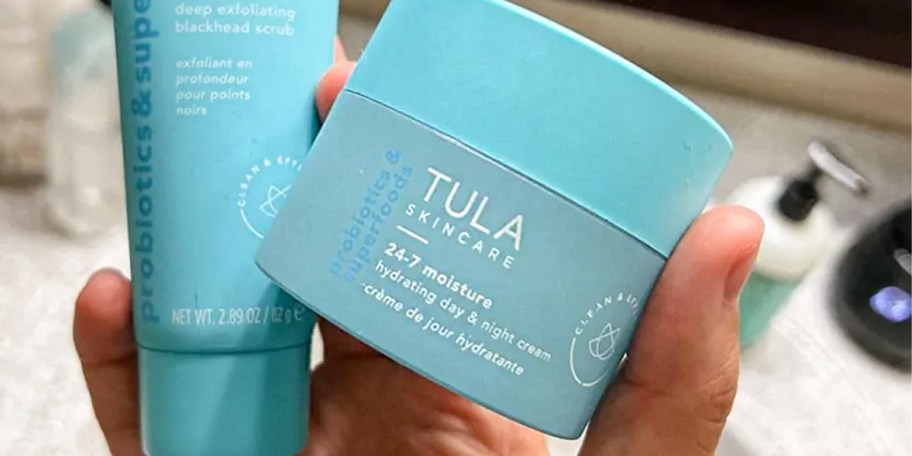 hand holding tula cream