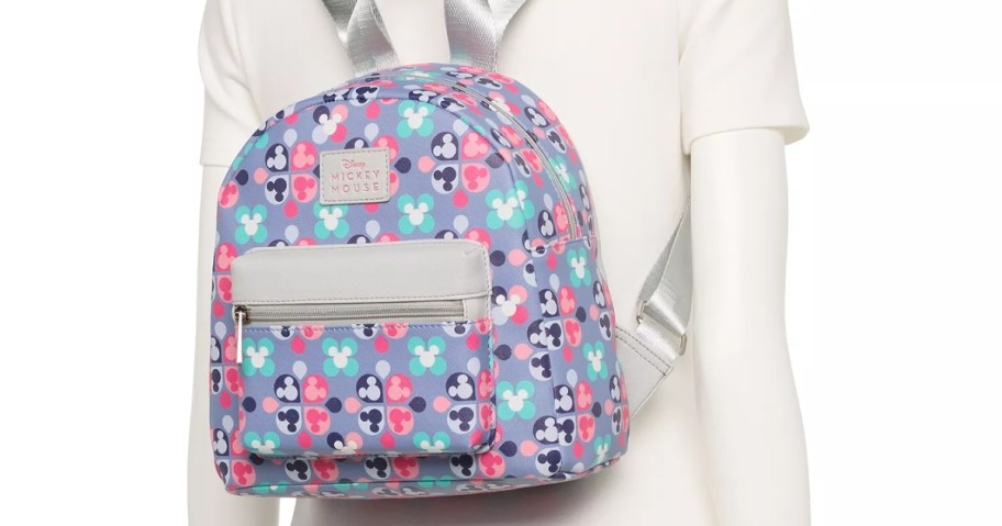 mannequin wearing a mickey mouse retro print mini backpack 