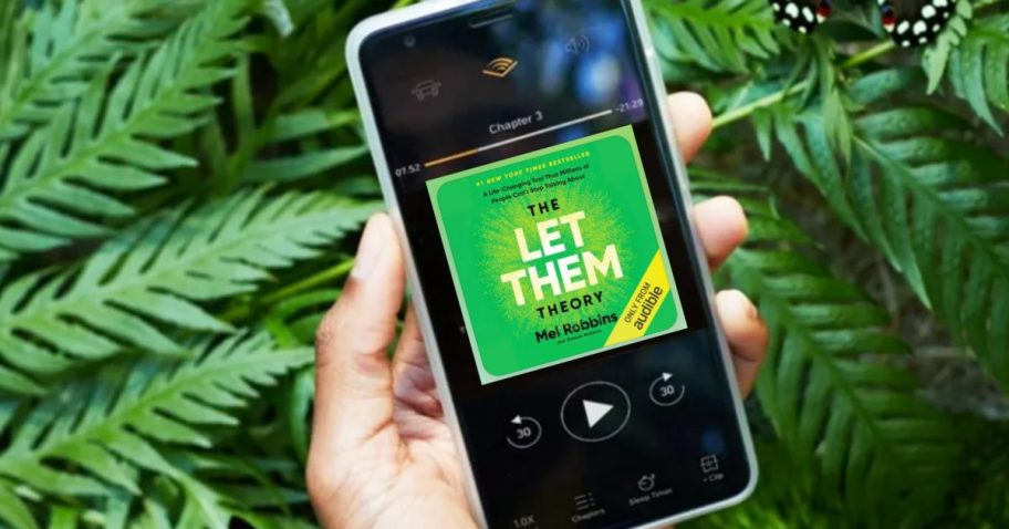 Person holding phone would let them audible book on screen