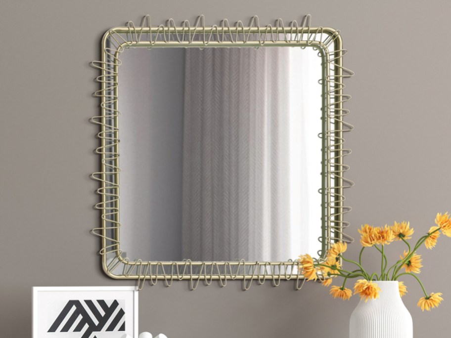 square round framed wall mirror displayed