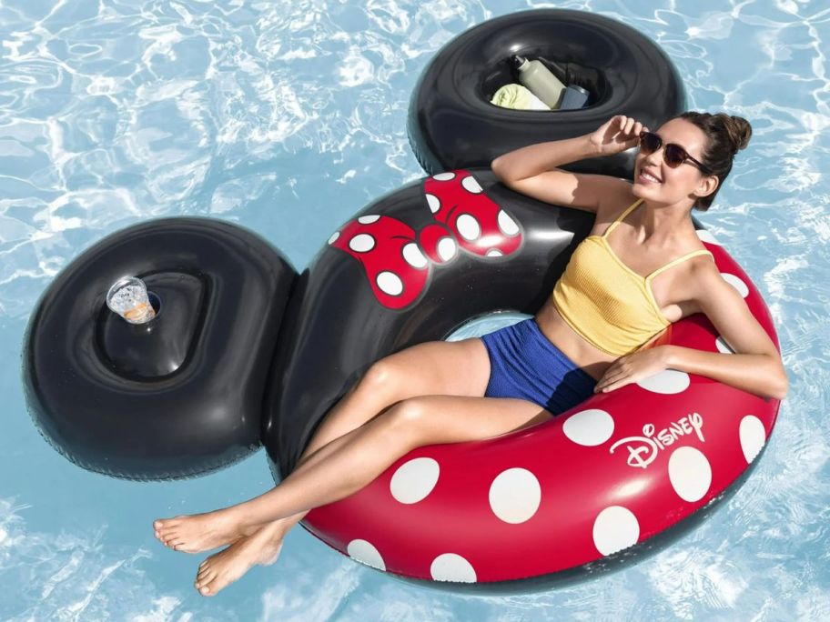 Woman laying in a Disney Minnie Mouse Inflatable Swim Tube 