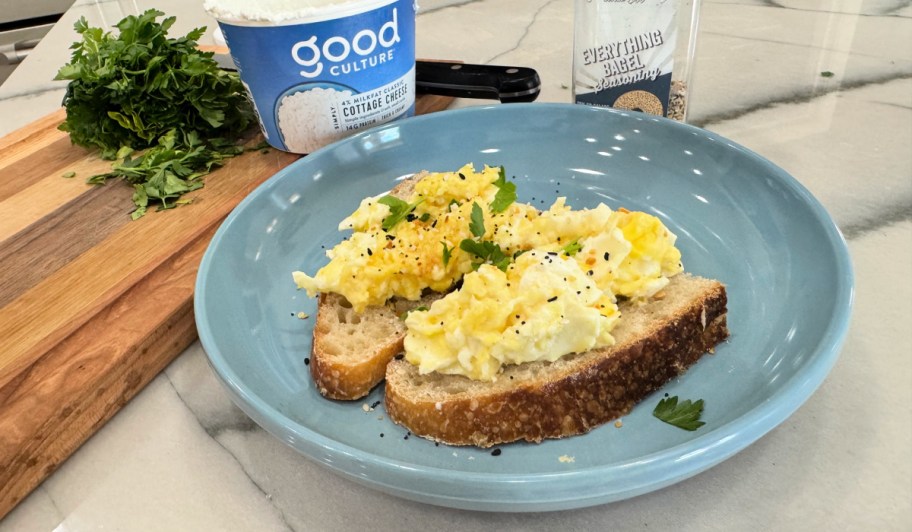 cottage cheese eggs on a plate with sourdough bread 