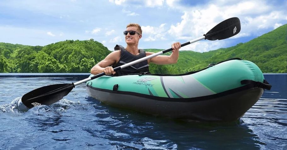 man in kayak on water