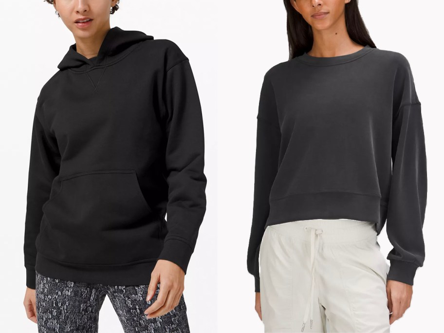 two women wearing black hoodie and sweatshirts