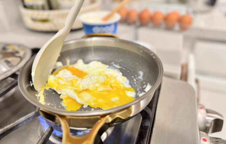scrambling eggs on an our place frying pan 