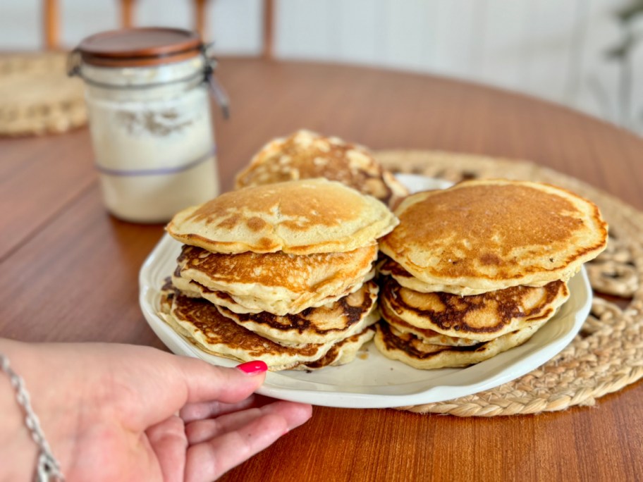 sourdough pancakes next to s sourdough starter