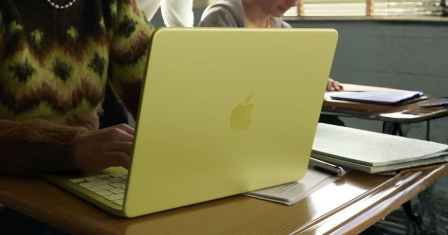 person using Apple 2026 MacBook Neo 13" Laptop in classroom