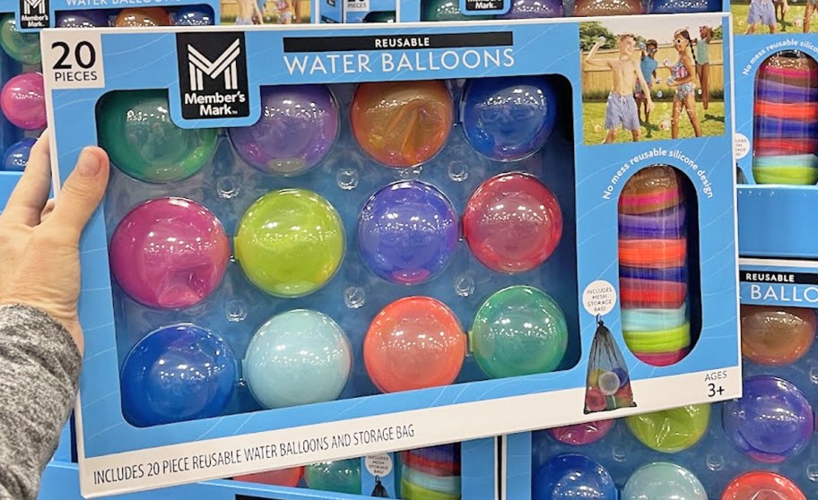 hand holding up a box of Member's Mark Self-Sealing Reusable Water Balloons in store