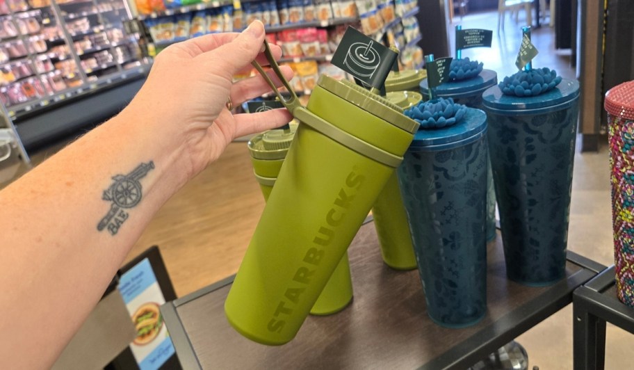 a womans hand holding an Olive Green Cold Cup 