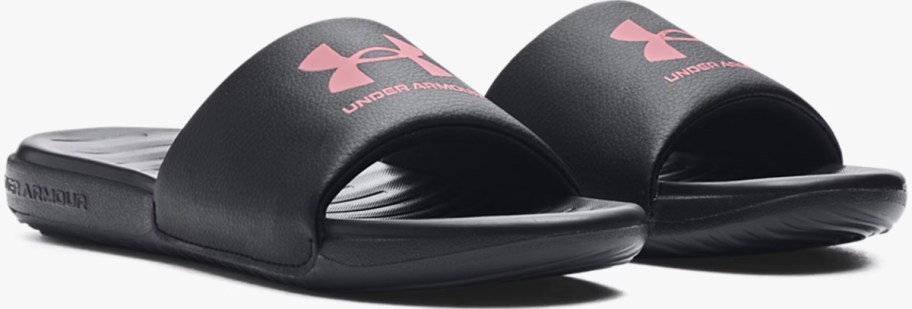 pair of black and pink under armour slides