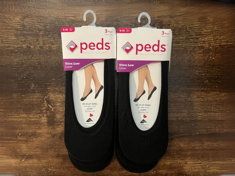 Peds Women's Lightweight Low Cut No Show Sock 6-Pack in Black packages on table