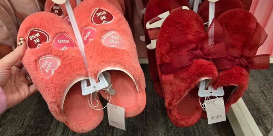pink and red slippers hanging in store 