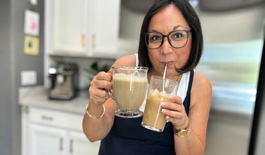 woman drinking protein coffee from a straw