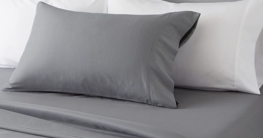 A bed with Amazon Basics Gray Sheets
